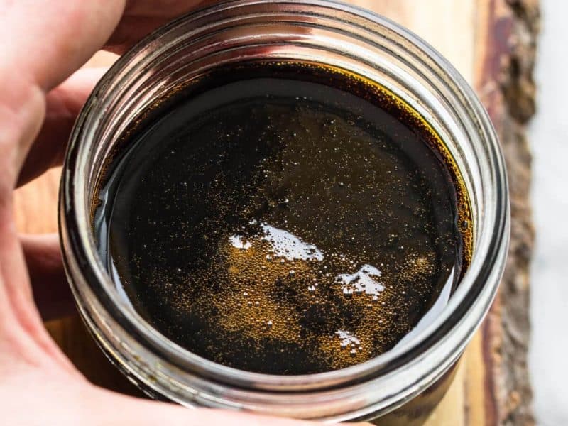 holding sweet soy in glass jar